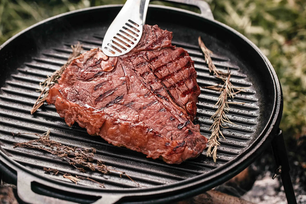 Slow-smoked porterhouse steaks seasoned with Jimmy P's rub, sliced and served after a hardwood smoke and hot charcoal sear.