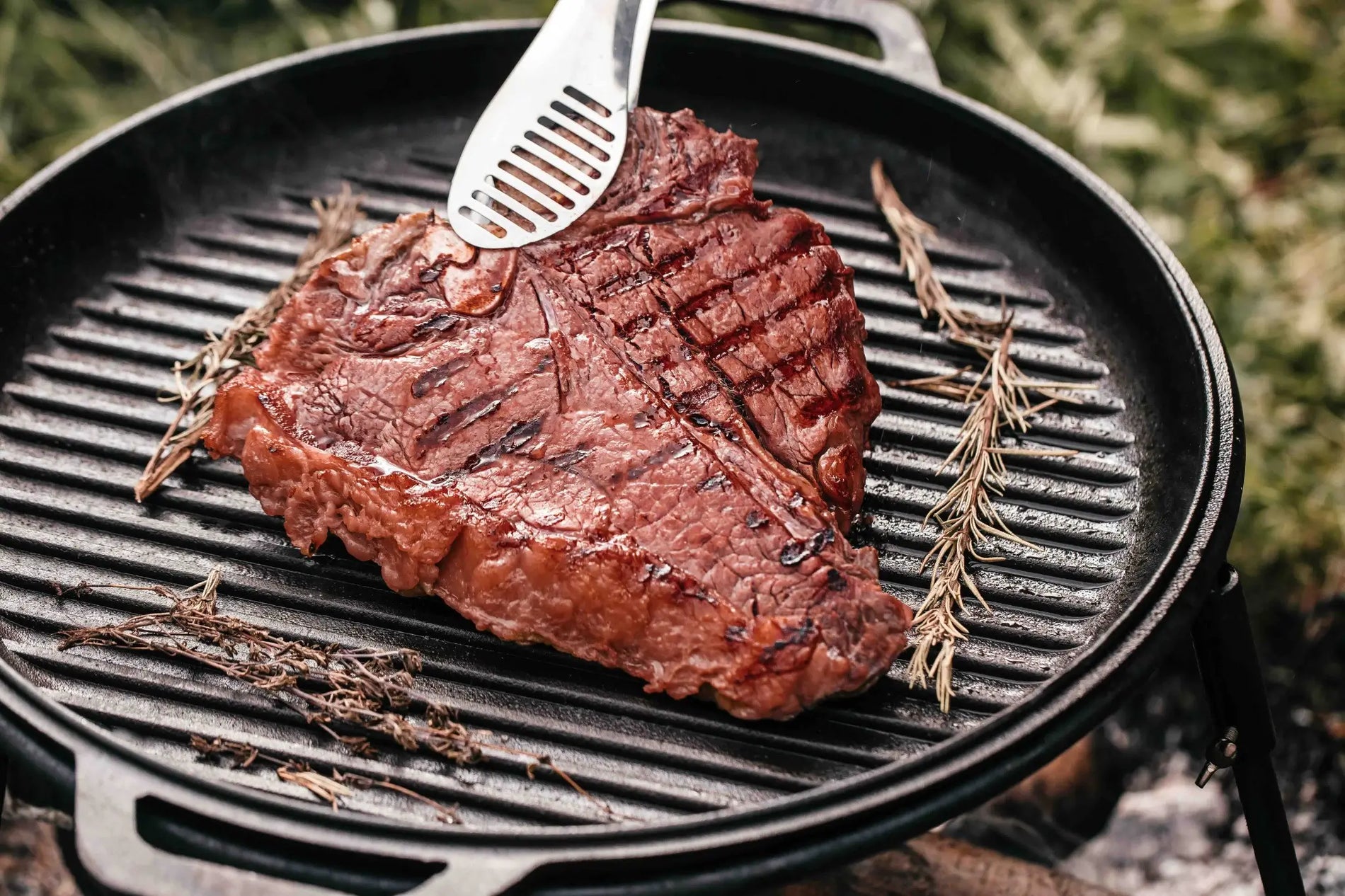Slow-smoked porterhouse steaks seasoned with Jimmy P's rub, sliced and served after a hardwood smoke and hot charcoal sear.