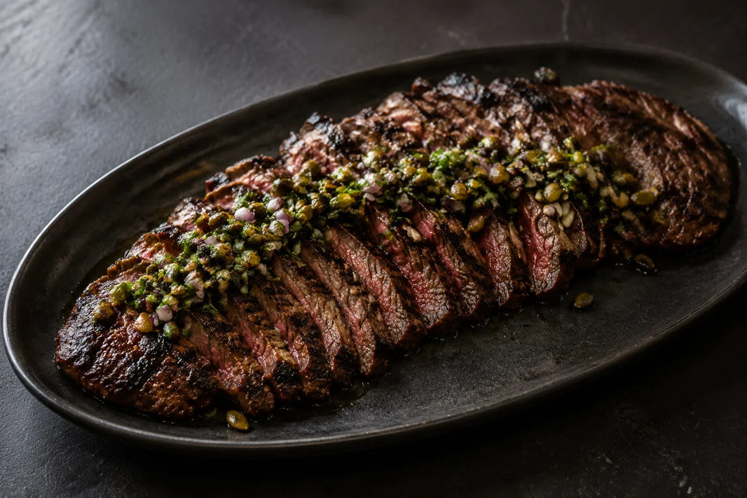 Sliced mojo-marinated Wagyu skirt steak with charred poblano and toasted pepita salsa