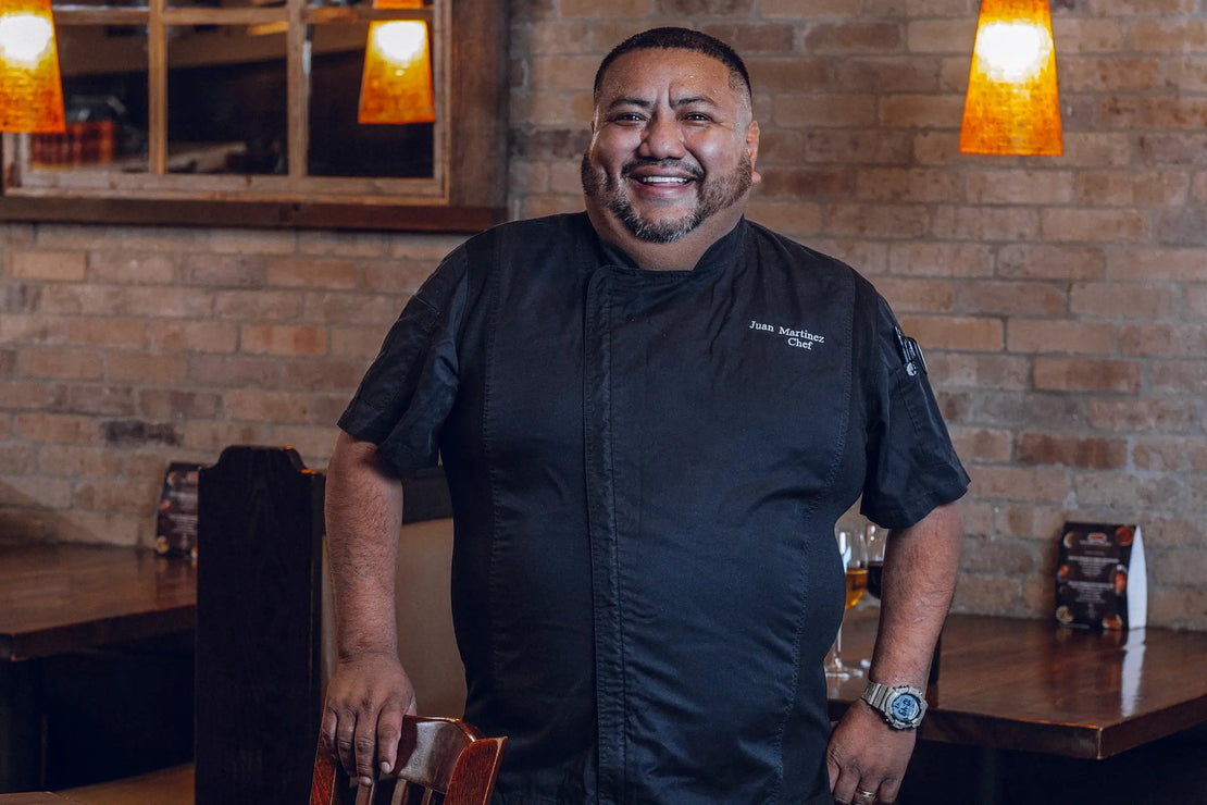 Butcher at Jimmy P's restaurant welcoming guests